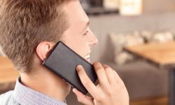 Man on phone smiling stock photo